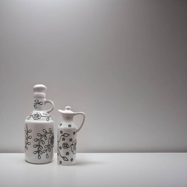 white ceramic oil bottle set